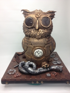 Steam Punk Owl Cake on a plain white background.  Note the lack of wrinkles. Levolor blind!